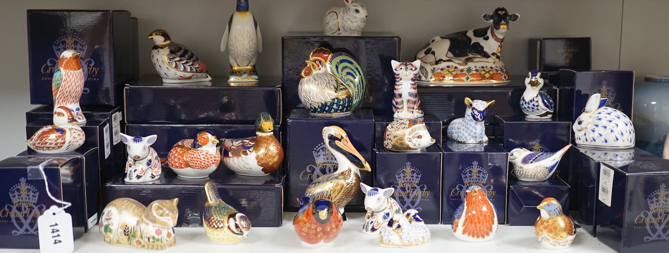 Approximately thirty-two Royal Crown Derby Imari porcelain paperweights, all but two with original boxes and mostly gold bottoms